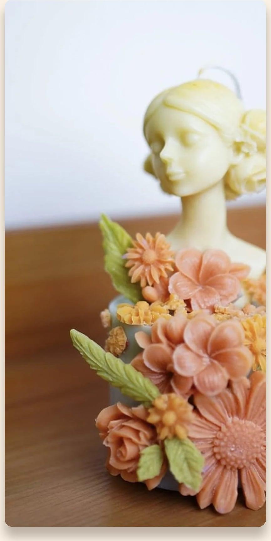 The Luma Flora sculpted bust candle
