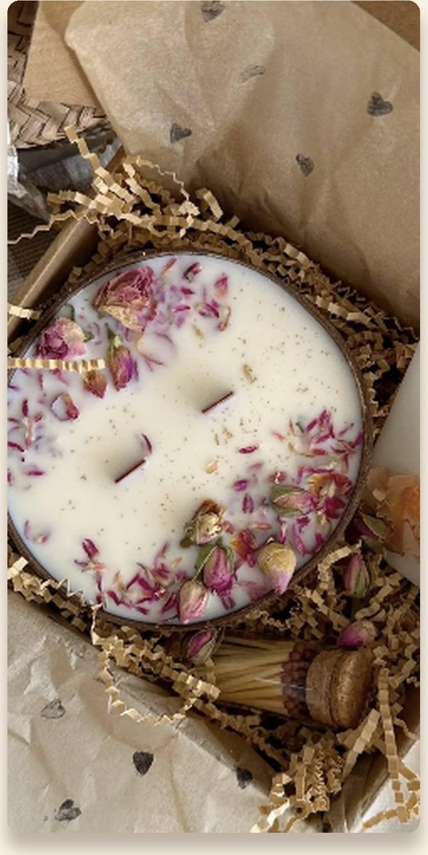 Double-wick round candle scattered with dried rose petals, boxed with matches