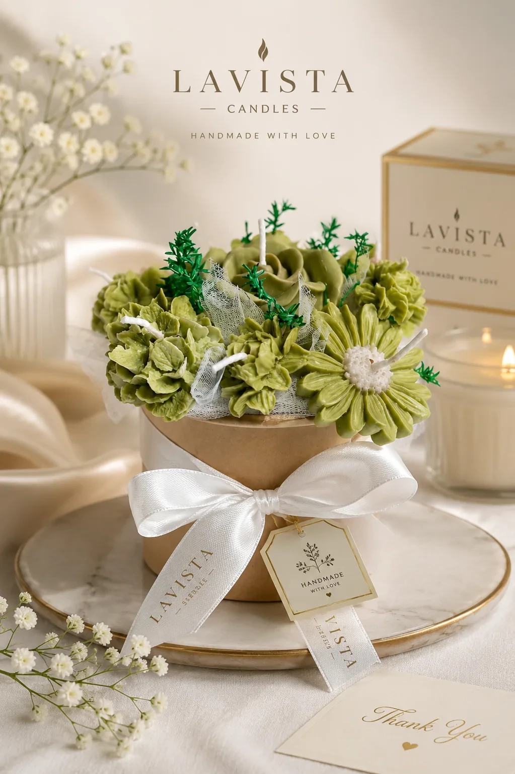 Small sage-green wax flower bouquet tied with a white ribbon